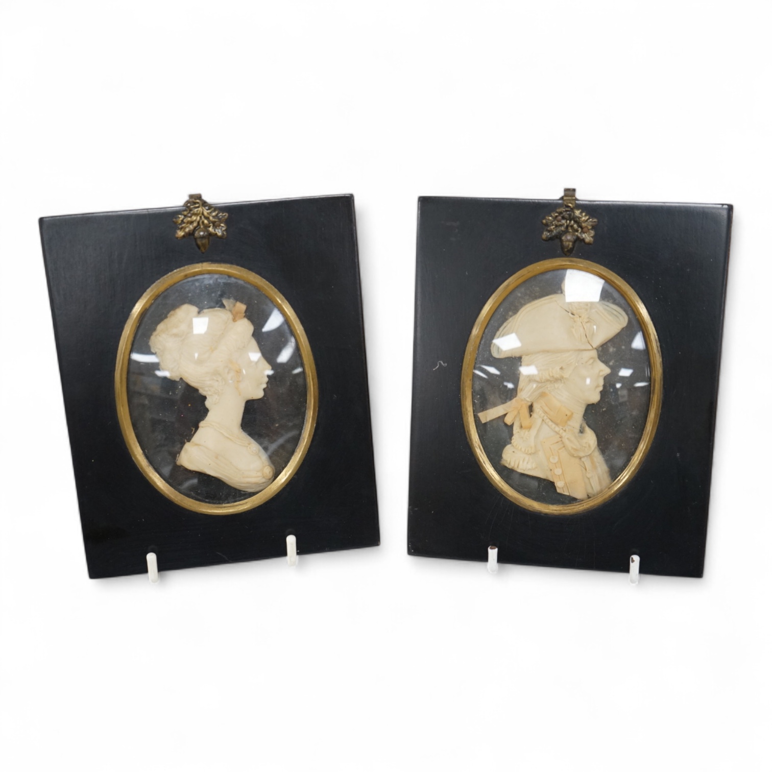 A pair of wax portrait busts by Leslie Ray depicting a Naval Officer and a lady, 16cm high